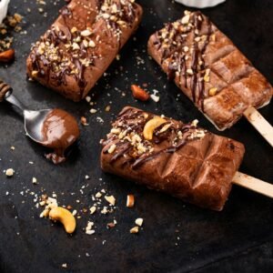 Chocolate ice cream popsicle with nut